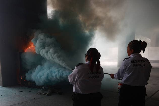 CNTE teachers hold third day of protests in Mexico City after declaring indefinite national strike MEXICO CITY, MEXICO - JUNE 03: Police officers use a fire extinguisher to put out flames in a firefighter equipment storage area at Mexico s Education Ministry building during a protest by CNTE teachers, in Mexico City, Mexico on June 03, 2026. Members of National Coordination of Education Workers (CNTE) forced their way into Mexico s Education Ministry building, causing damage to the facilities, as part of the third day of protests following the declaration of a national strike. Daniel Cardenas Anadolu Mexico City Mexico. Editorial use only. Please get in touch for any other usage.  Copyright: x2026xAnadoluxDanielxCardenasx