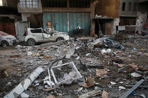 RECORD DATE NOT STATED Widespread Destruction and Resilience Amid Ongoing Humanitarian Crisis in Gaza City (INT) Widespread Destruction and Resilience Amid Ongoing Humanitarian Crisis in Gaza City. June 4, 2026, Gaza, Palestine: Widespread destruction clears a path through residential areas in Gaza City, where multi-story buildings stand heavily burned and damaged . Amidst the ruins, local residents and youth attempt to clear dark ash and rubble using primitive tools from the upper floors of targeted structures , while the streets are lined with shattered civilian vehicles covered in debris The scenes reflect the catastrophic impact of the ongoing conflict on infrastructure and daily life, highlighting the severe humanitarian conditions faced by the population i  Copyright: xHashemxZimmox