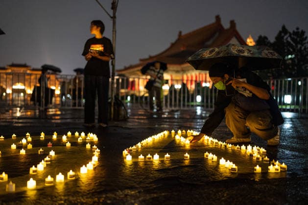 Taipei June 4 Vigil People placing candles on the ground at a June 4 Vigil at Liberty Square on June 4, 2026 in Taipei, Taiwan. (Photo by STR Nexpher Images) TAIPEI