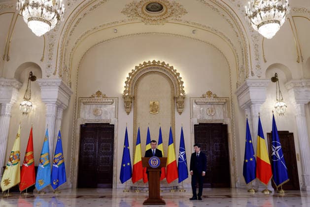 (260604) -- BUCHAREST, June 4, 2026 -- Romania s prime minister-designate Eugen Tomac (L) delivers a speech after being nominated by President Nicusor Dan as Nicusor Dan stands by at Cotroceni palace in Bucharest, Romania, on June 4, 2026. Romanian President Nicusor Dan on Thursday nominated his adviser Eugen Tomac as prime minister-designate. (Photo by Xinhua) ROMANIA-BUCHAREST-PM-DESIGNATE CristianxCristel 