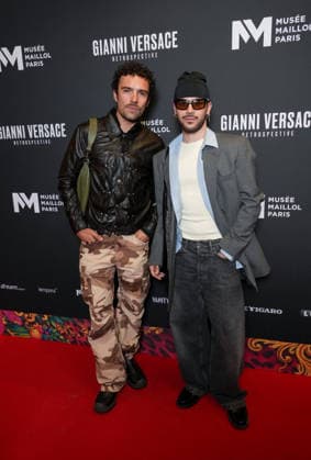 Mathis Bouquillion, Loïc Rodrigues Personalities at the first major French retrospective devoted to Gianni Versace at the Musée Maillol in Paris on June 4, 2026 Gianni Versace Retrospective brings together nearly 450 exceptional pieces - original creations and silhouettes, accessories, sketches, decorative objects, photographs, In a resolutely pop scenography designed by Nathalie Crinière, the exhibition retraces an entire career dedicated to creation, and reveals the multiple inspirations that shaped Versaces universe  Copyright: xAnne-SophiexGuebeyx xBestimagexAnne-SophiexGuebeyx xBestimagex