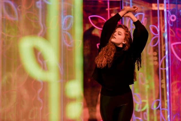 Expressive dancing in a vibrant neon light art installation model released, Symbolfoto, GMLF01715