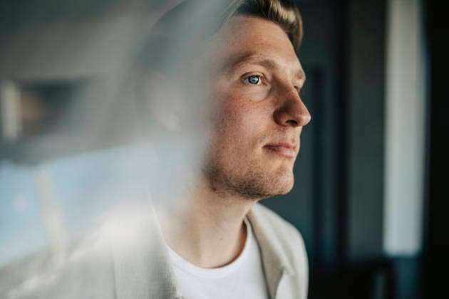 Thoughtful male entrepreneur gazing at coworking space Sweden, Stockholm, model released, property released Copyright: xMaskotx , MA125198 MA125198