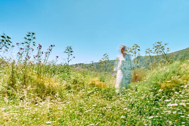 Ethereal woman in a peaceful spring wildflower meadow model released, Symbolfoto, CATF01004