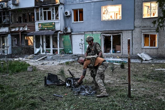 Law enforcers collect the wreckage of a strike drone used by Russian troops to attack a residential area in the Shevchenkivskyi district of Zaporizhzhia, Ukraine, June 4, 2026. Russian forces launched a drone strike on one of the city’s residential areas, killing one person and injuring 16 others. The blast wave and debris shattered windows and balconies in apartment blocks. (Photo by Dmytro Smolienko Ukrinform) Russian forces launch drone strike on district in Zaporizhzhia  Copyright: xDmytroxSmolienkox