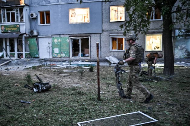 Law enforcers collect the wreckage of a strike drone used by Russian troops to attack a residential area in the Shevchenkivskyi district of Zaporizhzhia, Ukraine, June 4, 2026. Russian forces launched a drone strike on one of the city’s residential areas, killing one person and injuring 16 others. The blast wave and debris shattered windows and balconies in apartment blocks. (Photo by Dmytro Smolienko Ukrinform) Russian forces launch drone strike on district in Zaporizhzhia  Copyright: xDmytroxSmolienkox