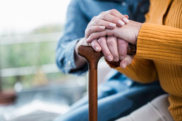 Close-up of nurse supporting patient hand on walking stick model released, Symbolfoto property released, UUF36759