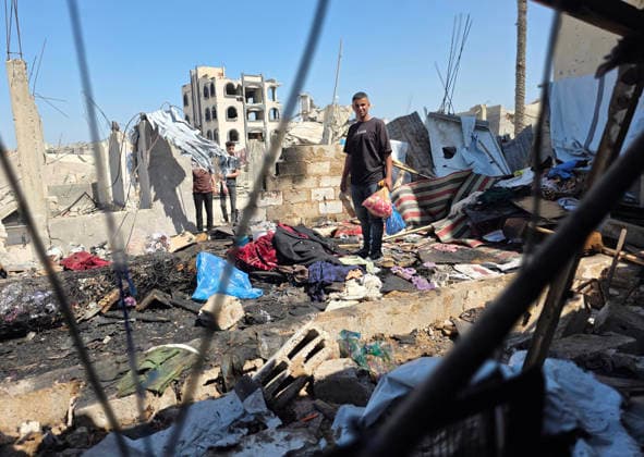 Palestinians Inspect Site of Deadly Strike in Khan Younis Palestinians inspect the damage at the site of an Israeli strike that targeted a tent belonging to the family of Mohannad Farwana on the rooftop of their home in central Khan Younis, southern Gaza Strip, on June 6, 2026. Farwana was killed after the tent caught fire in the strike, just hours before his scheduled wedding ceremony. Photo by Tariq Mohammad APA Images Khan Yunis Gaza Strip Palestinian Territory 060626_Khan_Yunis_TM_00(35) Copyright: xapaimagesxTariqxMohammad xapaimagesx