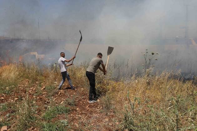 Israeli settlers set fire to Palestinians agricultural fields in the West Bank NABLUS, WEST BANK, PALESTINE - JUNE 06: Palestinians attempt to extinguish the fire using their own means after Israeli settlers set fire to agricultural fields belonging to Palestinians in the town of Huwara, near Nablus, West Bank, Palestine on June 06, 2026. Nedal Eshtayah Anadolu Nablus West Bank. Editorial use only. Please get in touch for any other usage.  Copyright: x2026xAnadoluxNedalxEshtayahx