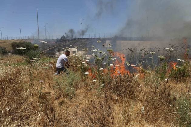 Israeli settlers set fire to Palestinians agricultural fields in the West Bank NABLUS, WEST BANK, PALESTINE - JUNE 06: Palestinians attempt to extinguish the fire using their own means after Israeli settlers set fire to agricultural fields belonging to Palestinians in the town of Huwara, near Nablus, West Bank, Palestine on June 06, 2026. Nedal Eshtayah Anadolu Nablus West Bank. Editorial use only. Please get in touch for any other usage.  Copyright: x2026xAnadoluxNedalxEshtayahx