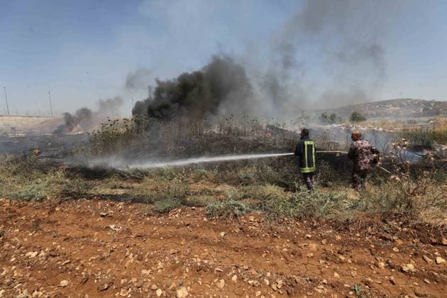 Israeli settlers set fire to Palestinians agricultural fields in the West Bank NABLUS, WEST BANK, PALESTINE - JUNE 06: Palestinians attempt to extinguish the fire using their own means after Israeli settlers set fire to agricultural fields belonging to Palestinians in the town of Huwara, near Nablus, West Bank, Palestine on June 06, 2026. Nedal Eshtayah Anadolu Nablus West Bank. Editorial use only. Please get in touch for any other usage.  Copyright: x2026xAnadoluxNedalxEshtayahx