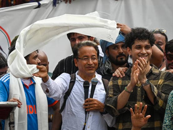 NEW DELHI, INDIA - JUNE 6: Sonam Wangchuk, Innovator and educator along with Abhijeet Dipke, Cockroach Janta Party leader with supporters during the protests at Jantar Mantar, on June 6, 2026 in New Delhi, India. Members and supporters of the Cockroach Janta Party (CJP) protest at Jantar Mantar to demand the resignation of Union Minister of Education, Dharmendra Pradhan. They claimed him to be directly responsible for the recent exam paper leaks in major national-level examinations across the country, including NEET. The party was started as a satirical online movement after remarks made by Chief Justice Surya Kant during a hearing. CJI Kant compared a section of young unemployed youth with fake law degrees to cockroaches. (Ph
