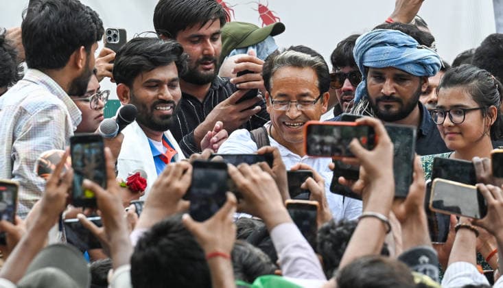 NEW DELHI, INDIA - JUNE 6: Cockroach Janta Party (CJP) founder Abhijeet Dipke, in blue, its spokespersons Saurav Das and Vijeta Dahiya, and Climate activist Sonam Wangchuk during a protest demanding the resignation of Union Education Minister Dharmendra Pradhan over alleged examination-related lapses, at the Jantar Mantar on June 6, 2026 in New Delhi, India. Members and supporters of the Cockroach Janta Party (CJP) protest at Jantar Mantar to demand the resignation of Union Minister of Education, Dharmendra Pradhan. They claimed him to be directly responsible for the recent exam paper leaks in major national-level examinations across the country, including NEET. The party was started as a satirical online movement after remarks made b