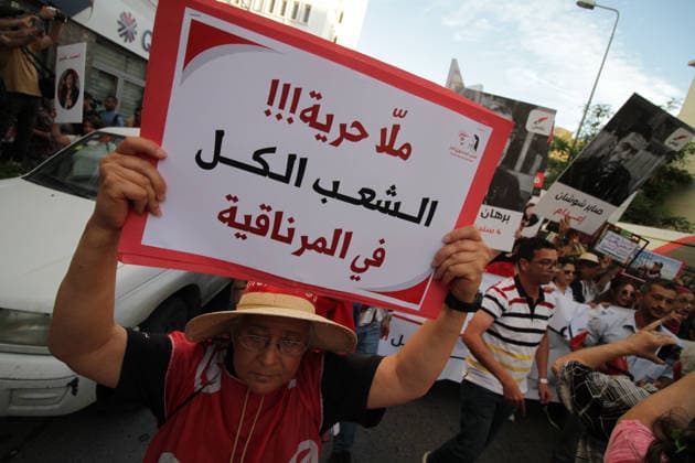 June 5, 2026, Tunis, Tunis, Tunisia, Tunisia: Demonstrators march through central Tunis during a protest demanding freedom of expression, independent public media, and an end to legal measures they say criminalize free speech, on June 5, 2026. The rally was organized in opposition to Decree-Law 54 and reflects growing concerns among civil society groups over restrictions on media freedoms and political dissent in Tunisia. Tunis Tunisia  - ZUMAm342 20260605_zsp_m342_015 Copyright: xHasanxMradx