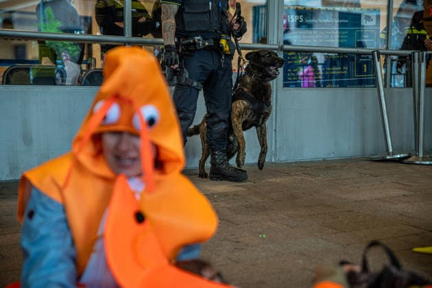 June 6, 2026, Rotterdam, South Holland, Netherlands: Rotterdam, Netherlands, 6 June 2026. Extinction Rebellion activists blocked the entrance to the Cruise Terminal on the Wilhelminakade on World Anti-Cruise Day. This temporarily preventing cruise passengers from boarding a moored cruise ship. Several activists were detained and four were arrested. Rotterdam Netherlands  - ZUMAp202 20260606_zip_p202_010 Copyright: xJamesxPetermeierx