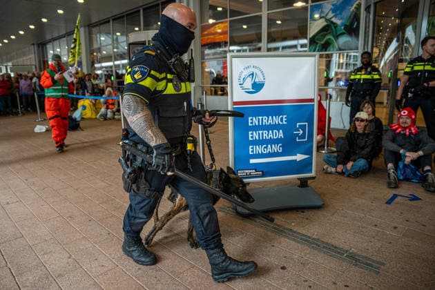 June 6, 2026, Rotterdam, South Holland, Netherlands: Rotterdam, Netherlands, 6 June 2026. Extinction Rebellion activists blocked the entrance to the Cruise Terminal on the Wilhelminakade on World Anti-Cruise Day. This temporarily preventing cruise passengers from boarding a moored cruise ship. Several activists were detained and four were arrested. Rotterdam Netherlands  - ZUMAp202 20260606_zip_p202_011 Copyright: xJamesxPetermeierx