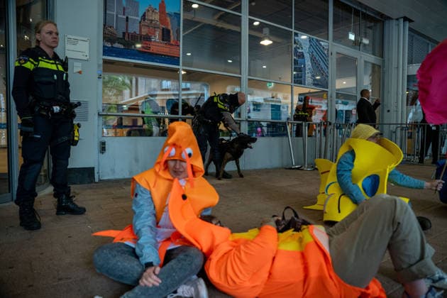 June 6, 2026, Rotterdam, South Holland, Netherlands: Rotterdam, Netherlands, 6 June 2026. Extinction Rebellion activists blocked the entrance to the Cruise Terminal on the Wilhelminakade on World Anti-Cruise Day. This temporarily preventing cruise passengers from boarding a moored cruise ship. Several activists were detained and four were arrested. Rotterdam Netherlands  - ZUMAp202 20260606_zip_p202_017 Copyright: xJamesxPetermeierx