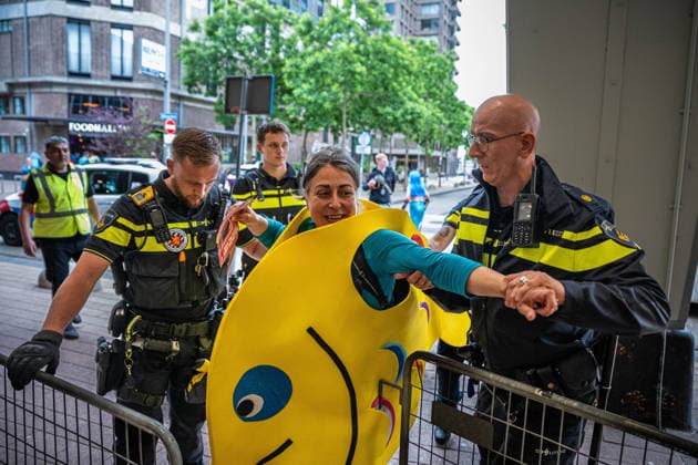 June 6, 2026, Rotterdam, South Holland, Netherlands: Rotterdam, Netherlands, 6 June 2026. Extinction Rebellion activists blocked the entrance to the Cruise Terminal on the Wilhelminakade on World Anti-Cruise Day. This temporarily preventing cruise passengers from boarding a moored cruise ship. Several activists were detained and four were arrested. Rotterdam Netherlands  - ZUMAp202 20260606_zip_p202_008 Copyright: xJamesxPetermeierx