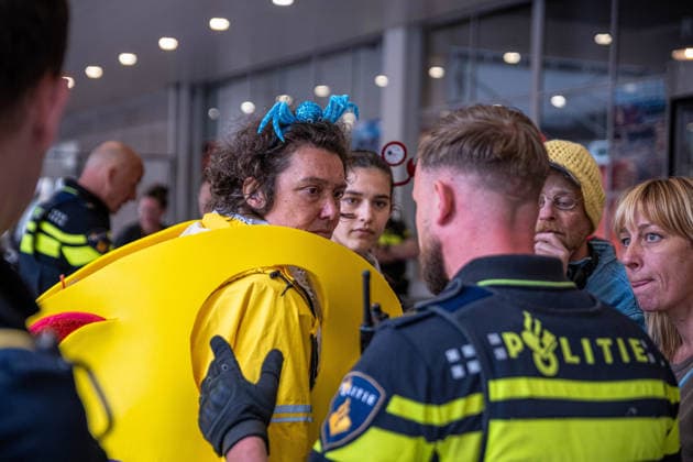 June 6, 2026, Rotterdam, South Holland, Netherlands: Rotterdam, Netherlands, 6 June 2026. Extinction Rebellion activists blocked the entrance to the Cruise Terminal on the Wilhelminakade on World Anti-Cruise Day. This temporarily preventing cruise passengers from boarding a moored cruise ship. Several activists were detained and four were arrested. Rotterdam Netherlands  - ZUMAp202 20260606_zip_p202_015 Copyright: xJamesxPetermeierx