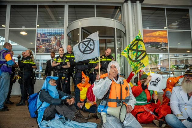 June 6, 2026, Rotterdam, South Holland, Netherlands: Rotterdam, Netherlands, 6 June 2026. Extinction Rebellion activists blocked the entrance to the Cruise Terminal on the Wilhelminakade on World Anti-Cruise Day. This temporarily preventing cruise passengers from boarding a moored cruise ship. Several activists were detained and four were arrested. Rotterdam Netherlands  - ZUMAp202 20260606_zip_p202_002 Copyright: xJamesxPetermeierx