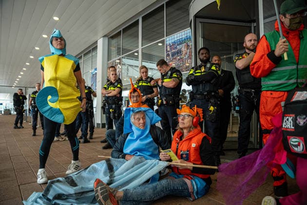 June 6, 2026, Rotterdam, South Holland, Netherlands: Rotterdam, Netherlands, 6 June 2026. Extinction Rebellion activists blocked the entrance to the Cruise Terminal on the Wilhelminakade on World Anti-Cruise Day. This temporarily preventing cruise passengers from boarding a moored cruise ship. Several activists were detained and four were arrested. Rotterdam Netherlands  - ZUMAp202 20260606_zip_p202_042 Copyright: xJamesxPetermeierx