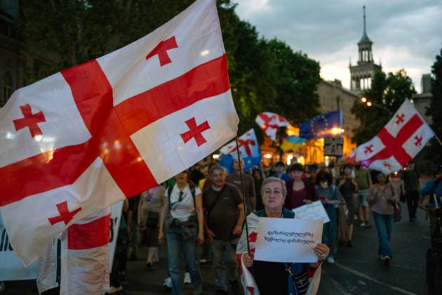 June 6, 2026, Tbilisi, Georgia: Tbilisi, Georgia, June 6, 2026. Protesters hold Georgian flags as they march to the Georgian Parliament building on the 556th day of anti-government rallies in Tbilisi. Tbilisi Georgia  - ZUMAz174 20260606_zip_z174_006 Copyright: xMoexZoyarix