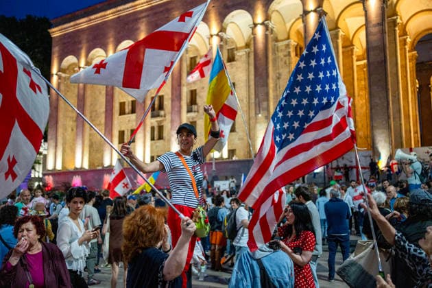 June 6, 2026, Tbilisi, Georgia: Tbilisi, Georgia, June 6, 2026. Protesters hold U.S. and Georgian flags in front of the Parliament building on the 556th day of anti-government rallies in Tbilisi. Tbilisi Georgia  - ZUMAz174 20260606_zip_z174_005 Copyright: xMoexZoyarix