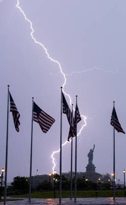 Lightning Flashes Behind The Statue of Liberty as Storm Hits New York NEW YORK, UNITED STATES – JUNE 6: Lightning flashes across New York Harbor during a powerful thunderstorm as the Statue of Liberty and American flags are seen in the background in New York City, United States, on June 6, 2026. Heavy rain, strong winds and frequent lightning affected parts of the New York metropolitan area as severe weather moved through the region. Lokman Vural Elibol Anadolu New York United States. Editorial use only. Please get in touch for any other usage.  Copyright: x2026xAnadoluxLokmanxVuralxElibolx
