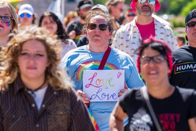 June 6, 2026, Salt Lake City, Utah, USA: A participant holds a sign reading Love is Love while walking with a crowd during the Utah Pride Rally and March. Salt Lake City USA - ZUMAm292 20260606_znp_m292_006 Copyright: xCharlesxMcClintockxWilsonx