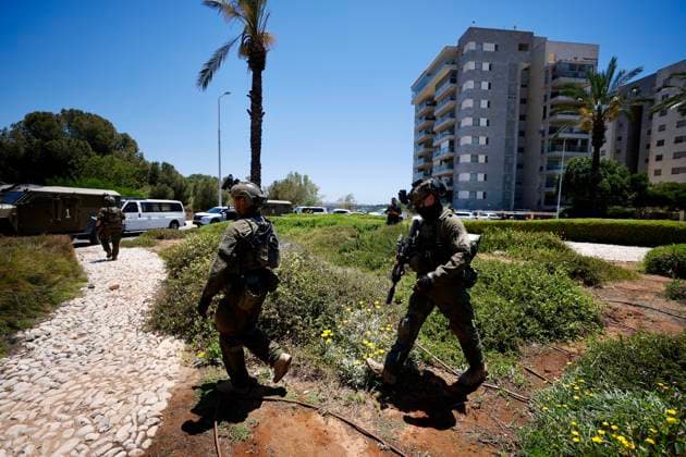 (260607) -- KOCHAV YA IR, June 7, 2026 -- Security personnel work at the scene of a shooting incident in the Kochav Ya ir area of central Israel, June 7, 2026. One person was killed and five others were injured in a shooting in central Israel on Sunday before the suspected attacker was shot, in what Israeli security services described as a terror attack. The shooting occurred at three locations in the Kochav Ya ir area of central Israel, near the border with the West Bank, according to reports. (Photo by Xinhua) ISRAEL-KOCHAV YA IR-SHOOTING INCIDENT JamalxAwad 