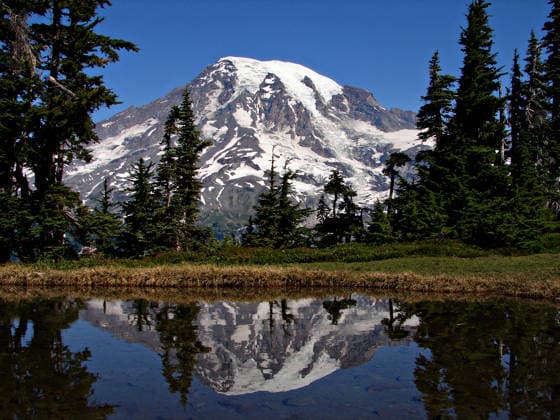 Creative Highlights World Mount Rainier National Park Aug. 14, 2006 - Ashford, WA, United States of America - Mount Rainier reflected in a glacier lake in the Tatoosh Range of Mount Rainier National Park August 14, 2006 in Ashford, WA. Copyright: xNpsx
