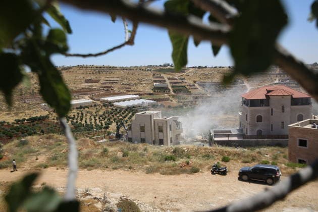 Israeli Forces Demolish Palestinian Home and Workshop Near Hebron Israeli bulldozers demolish the two-story home of Palestinian resident Nayef Abu Sneineh and a carpentry workshop in the Khirbet Qalqas area south of Hebron in the occupied West Bank, on June 8, 2026, as Palestinians inspect the rubble and damage at the site. Photo by Mamoun Wazwaz apaimages Hebron West Bank Palestinian Territory 080626_Hebron_MW_01(34) Copyright: xapaimagesxMamounxWazwazx xapaimagesx