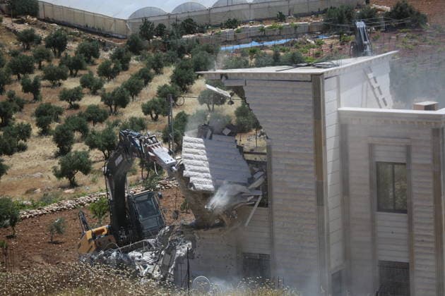 Israeli Forces Demolish Palestinian Home and Workshop Near Hebron Israeli bulldozers demolish the two-story home of Palestinian resident Nayef Abu Sneineh and a carpentry workshop in the Khirbet Qalqas area south of Hebron in the occupied West Bank, on June 8, 2026, as Palestinians inspect the rubble and damage at the site. Photo by Mamoun Wazwaz apaimages Hebron West Bank Palestinian Territory 080626_Hebron_MW_01(35) Copyright: xapaimagesxMamounxWazwazx xapaimagesx