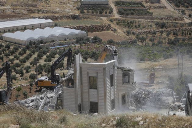 Israeli Forces Demolish Palestinian Home and Workshop Near Hebron Israeli bulldozers demolish the two-story home of Palestinian resident Nayef Abu Sneineh and a carpentry workshop in the Khirbet Qalqas area south of Hebron in the occupied West Bank, on June 8, 2026, as Palestinians inspect the rubble and damage at the site. Photo by Mamoun Wazwaz apaimages Hebron West Bank Palestinian Territory 080626_Hebron_MW_01(9) Copyright: xapaimagesxMamounxWazwazx xapaimagesx