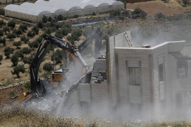 Israeli army demolishes Palestinian home in West Bank, leaving 5 homeless HEBRON, WEST BANK, PALESTINE - JUNE 08: Israeli army heavy machinery demolishes a 2-story Palestinian house, built on a 500-square-meter area and belonging to Nayif Abu Sneineh, as Israeli soldiers take security measures in Qalqas village, south of the West Bank city of Hebron, Palestine on June 08, 2026. The demolition leaves five family members homeless. Wisam Hashlamoun Anadolu Hebron West Bank. Editorial use only. Please get in touch for any other usage.  Copyright: x2026xAnadoluxWisamxHashlamounx