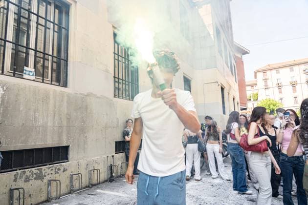 IPA85483607 - Milan, 8 6 26, Liceo Parini, last day of school, boys celebrate with foam, flour and water guns and smoke bombs.  Copyright: xGiuliaxSciaccax xGiuliaxSciaccax 85483607