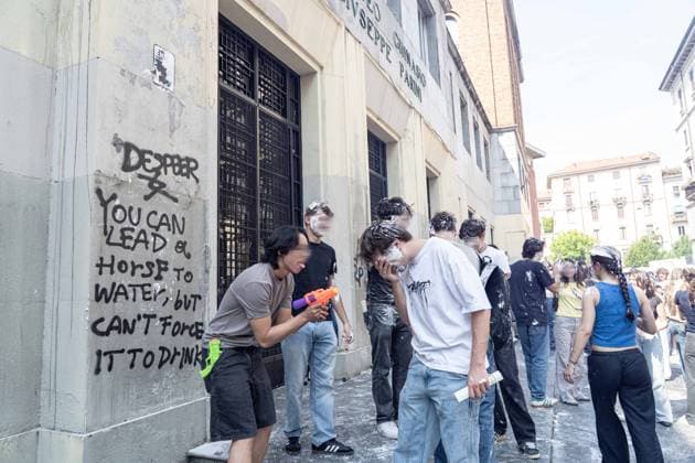 IPA85483620 - Milan, 8 6 26, Liceo Parini, last day of school, boys celebrate with foam, flour and water guns and smoke bombs.  Copyright: xGiuliaxSciaccax xGiuliaxSciaccax 85483620