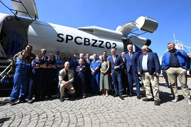 From left: American astronaut Andrew Feustel (crouching), SPD Minister of Defense Jaromir Zuna (in the background), next to him on the right, Prime Minister Andrej Babis (ANO), future Czech astronaut and pilot Ales Svoboda, Minister of Industry and Trade Karel Havlicek (ANO), U.S. Ambassador to the Czech Republic Nicholas Merrick, the first Czechoslovak cosmonaut Vladimir Remek, and, far right, Danish ESA astronaut Andreas Mogensen pose with participants of the Zero-G mission in front of the SpaceBuzz mobile rocket, which offers visitors a virtual journey into space and a view of Earth through the eyes of astronauts, within an an event for the Czech Journey to Space project, featuring an educational program and a virtual space mission, at  CTKPhotoP2026060805679