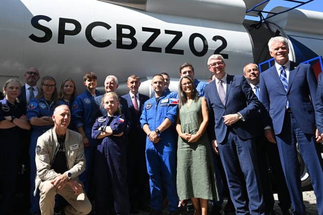 From left: American astronaut Andrew Feustel (crouching), SPD Minister of Defense Jaromir Zuna (in the background), next to him on the right, Prime Minister Andrej Babis (ANO), future Czech astronaut and pilot Ales Svoboda, Minister of Industry and Trade Karel Havlicek (ANO) and U.S. Ambassador to the Czech Republic Nicholas Merrick pose with participants of the Zero-G mission in front of the SpaceBuzz mobile rocket, which offers visitors a virtual journey into space and a view of Earth through the eyes of astronauts, within an an event for the Czech Journey to Space project, featuring an educational program and a virtual space mission, at Prague Exhibition Grounds, Prague Czech Republic, on June 8, 2026. (CTKxPhoto KaterinaxSulova) CTKP  CTKPhotoP2026060805686