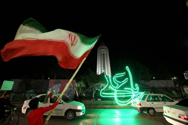 June 8, 2026, Iran, Iran: A supporter waves an Iranian national flag during a state-organized rally in Iran. Air raid sirens sounded in Israel on June 7 as its military worked to intercept incoming Iranian missiles for the first time since an April ceasefire took hold in the Middle East war. IranÃ¢â‚¬â ¢s Revolutionary Guards called the attack a Ã¢â‚¬oewarningÃ¢â‚¬Â after Israel struck BeirutÃ¢â‚¬â ¢s southern suburbs earlier in the day, while Tehran said the renewed hostilities would affect ongoing peace talks with Washington. Iran said on June 8 it was ending its latest military operation against Israel after overnight missile fire and Israeli strikes on military sites in the Islamic Republic, but warned it could deliver a more Ã¢â‚¬oecr - ZUMAi98_ 20260608_zih_i98_001 Copyright: xIranianxSupremexLeader SxOfficex