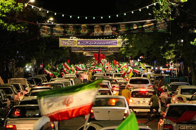 June 8, 2026, Iran, Iran: Cars and crowds fill a street lined with Iranian flags during a state-organized rally in Iran. Air raid sirens sounded in Israel on June 7 as its military worked to intercept incoming Iranian missiles for the first time since an April ceasefire took hold in the Middle East war. IranÃ¢â‚¬â ¢s Revolutionary Guards called the attack a Ã¢â‚¬oewarningÃ¢â‚¬Â? after Israel struck BeirutÃ¢â‚¬â ¢s southern suburbs earlier in the day, while Tehran said the renewed hostilities would affect ongoing peace talks with Washington. Iran said on June 8 it was ending its latest military operation against Israel after overnight missile fire and Israeli strikes on military sites in the Islamic Republic, but warned it could deliver a mo - ZUMAi98_ 20260608_zih_i98_004 Copyright: xIranianxSupremexLeader SxOfficex