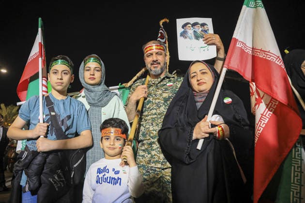 June 8, 2026, Iran, Iran: A family poses with Iranian national flags and pro-government headbands during a state-organized rally in Iran. Air raid sirens sounded in Israel on June 7 as its military worked to intercept incoming Iranian missiles for the first time since an April ceasefire took hold in the Middle East war. IranÃ¢â‚¬â ¢s Revolutionary Guards called the attack a Ã¢â‚¬oewarningÃ¢â‚¬Â after Israel struck BeirutÃ¢â‚¬â ¢s southern suburbs earlier in the day, while Tehran said the renewed hostilities would affect ongoing peace talks with Washington. Iran said on June 8 it was ending its latest military operation against Israel after overnight missile fire and Israeli strikes on military sites in the Islamic Republic, but warned it c - ZUMAi98_ 20260608_zih_i98_008 Copyright: xIranianxSupremexLeader SxOfficex