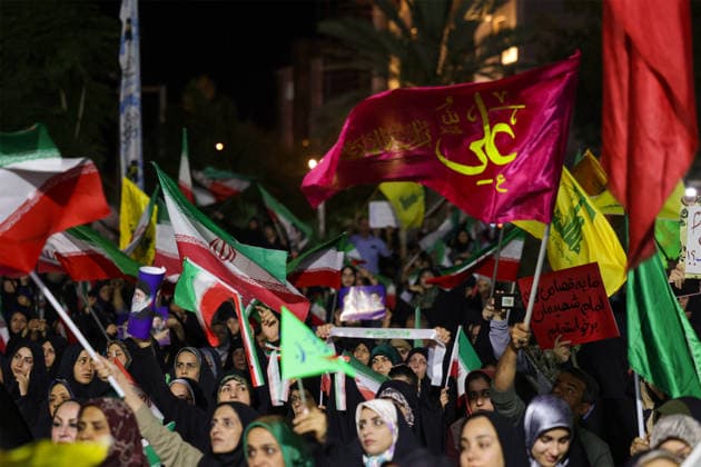 June 8, 2026, Iran, Iran: Supporters wave Iranian and religious flags during a state-organized rally in Iran. Air raid sirens sounded in Israel on June 7 as its military worked to intercept incoming Iranian missiles for the first time since an April ceasefire took hold in the Middle East war. IranÃ¢â‚¬â ¢s Revolutionary Guards called the attack a Ã¢â‚¬oewarningÃ¢â‚¬Â after Israel struck BeirutÃ¢â‚¬â ¢s southern suburbs earlier in the day, while Tehran said the renewed hostilities would affect ongoing peace talks with Washington. Iran said on June 8 it was ending its latest military operation against Israel after overnight missile fire and Israeli strikes on military sites in the Islamic Republic, but warned it could deliver a more Ã¢â‚¬oec - ZUMAi98_ 20260608_zih_i98_009 Copyright: xIranianxSupremexLeader SxOfficex