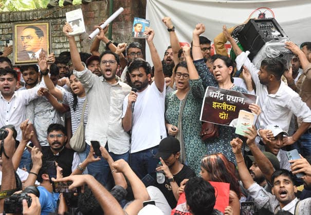India: Cockroach Janta Party Protest in New Delhi Abhijeet Dipke, head of the Cockroach Janta Party (CJP), during a protest shows a copy of a book authored by Bhimrao Ambedkar, considered the father of Indian Constitution. School students, college-goers, competitive exam aspirants and parents were among those who gathered for a protest organized by the Cockroach Janta Party (CJP), for their concerns over the education system had brought them to the demonstration. New Delhi India Copyright: SondeepxShankar