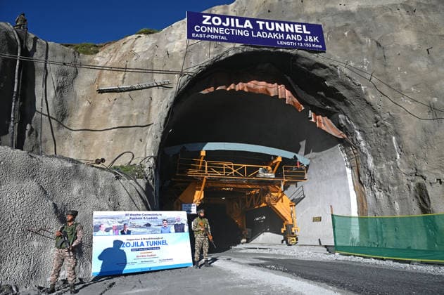 DRASS, INDIA - JUNE 9: Paramilitary soldiers stand guard at East Portal of Zojila Tunnel after the historic breakthrough ceremony of the Zojila Tunnel at Meenamarg on June 9, 2026 in Drass, India. Build at the cost of Rs 6000 Cr. the 13.15 KM tunnel is now the world s longest single-tube, bi-directional road tunnel at an elevation exceeding 11,500 feet. The historic breakthrough brings a decades-old national security dream closer to reality. For generations, the treacherous Zojila Pass on National Highway 1 (NH-1) has functioned as a severe logistical bottleneck, shutting down completely for three to four months during peak winter due to heavy avalanches, massive snow accumulation, and sub-zero structural icing.(Photo by Waseem Andrabi Hin