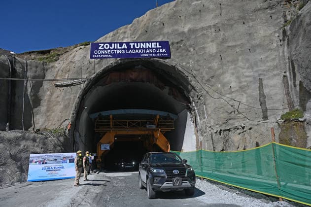 DRASS, INDIA - JUNE 9: Vehicles exit the East Portal of Zojila Tunnel after the historic breakthrough ceremony of the Zojila Tunnel at Meenamarg on June 9, 2026 in Drass, India. Build at the cost of Rs 6000 Cr. the 13.15 KM tunnel is now the world s longest single-tube, bi-directional road tunnel at an elevation exceeding 11,500 feet. The historic breakthrough brings a decades-old national security dream closer to reality. For generations, the treacherous Zojila Pass on National Highway 1 (NH-1) has functioned as a severe logistical bottleneck, shutting down completely for three to four months during peak winter due to heavy avalanches, massive snow accumulation, and sub-zero structural icing.(Photo by Waseem Andrabi Hindustan Times) Union