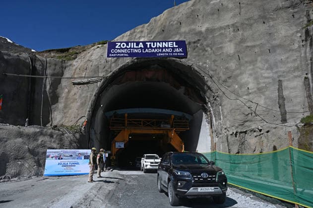 DRASS, INDIA - JUNE 9: Vehicles exit the East Portal of Zojila Tunnel after the historic breakthrough ceremony of the Zojila Tunnel at Meenamarg on June 9, 2026 in Drass, India. Build at the cost of Rs 6000 Cr. the 13.15 KM tunnel is now the world s longest single-tube, bi-directional road tunnel at an elevation exceeding 11,500 feet. The historic breakthrough brings a decades-old national security dream closer to reality. For generations, the treacherous Zojila Pass on National Highway 1 (NH-1) has functioned as a severe logistical bottleneck, shutting down completely for three to four months during peak winter due to heavy avalanches, massive snow accumulation, and sub-zero structural icing.(Photo by Waseem Andrabi Hindustan Times) Union