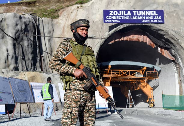 Final Breakthrough Ceremony of the Zojila Tunnel, Security Tightens Kargil Ladakh , Jun 09 (ANI): A security official stands guard ahead of the final breakthrough ceremony of the world s longest single-tube bidirectional Zojila Tunnel, graced by Union Road Transport and Highways Minister Nitin Gadkari, Jammu and Kashmir Chief Minister Omar Abdullah, and state Lieutenant Governor Manoj Sinha at Minamarg, in Kargil on Tuesday. Kargil Ladakh India Copyright: xANIx ANI_20260609064