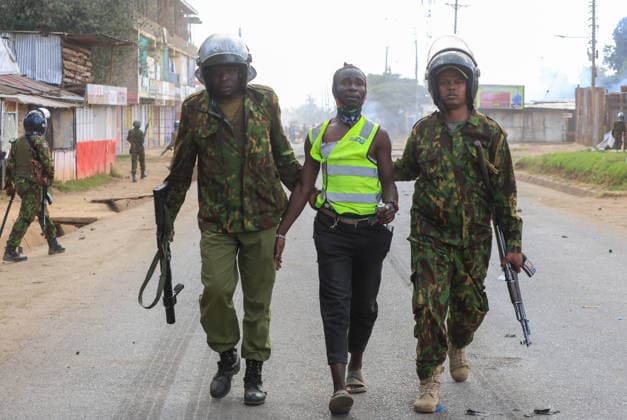 Protest held in Kenya against planned U.S. Ebola quarantine facility NANYUKI, KENYA - JUNE 09: Kenyan police detain a protester during a demonstration against a planned Ebola quarantine facility for U.S. citizens in Nanyuki, central Kenya on June 09, 2026. Dozens of people gathered to protest the facility, blocking a road and setting fires before police intervened to disperse the crowd. Lucas Mukasa Anadolu Nanyuki Kenya. Editorial use only. Please get in touch for any other usage.  Copyright: x2026xAnadoluxLucasxMukasax