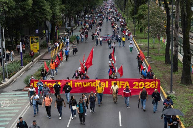 June 9, 2026, Mexico City, Mexico: Members of the National Coordinator of Education Workers (CNTE) marched from TaxqueoÂ±a to Mexico City Stadium as part of the national teachers strike and their encampment in the Mexican capital. During their march to the stadium, they were stopped by a large police presence and the deployment of a crane and barricades. The demonstration was part of a series of actions organized by the union to demand better working conditions and reforms to the pension system, just days before the start of the 2026 FIFA World Cup in Mexico. Mexico City Mexico - ZUMAl178 20260609_znp_l178_009 Copyright: xCristianxLeyvax